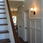 White wainscoting refinished banister and stairs