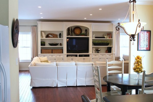 This white built-in entertainment center makes this room feel grand and  inviti…  Living room entertainment center, Living room built ins, Living  room entertainment