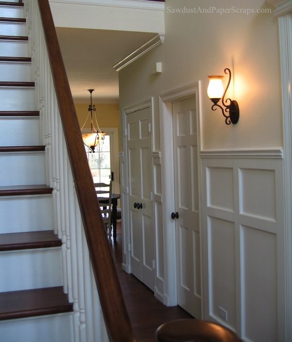 White wainscoting refinished banister and stairs