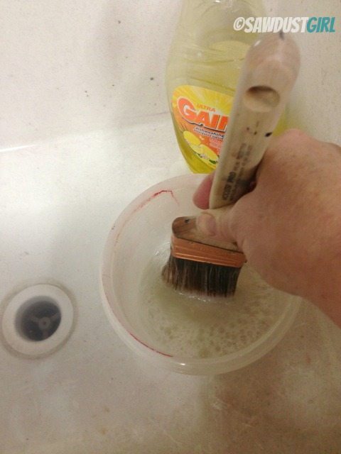 cleaning a paintbrush with white spirit