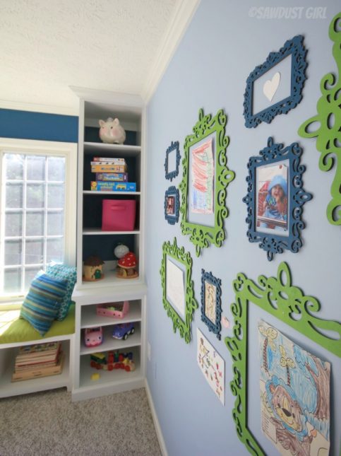 How to Build Built-in Playroom Window Seat and Storage Cabinets - Whimsical art display. https://sawdustdiaries.com