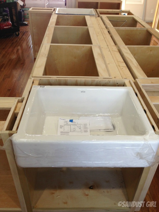 Kitchen island cabinets with farmhouse sink.