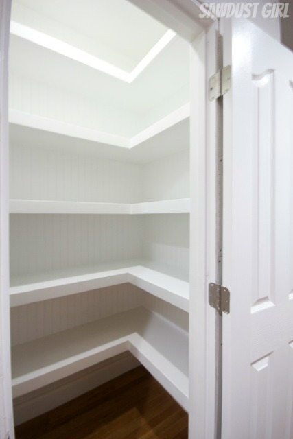 Hall closet with floating shelves