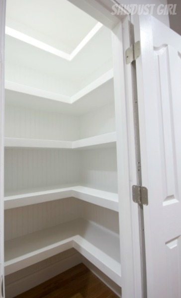 Hall closet with floating shelves