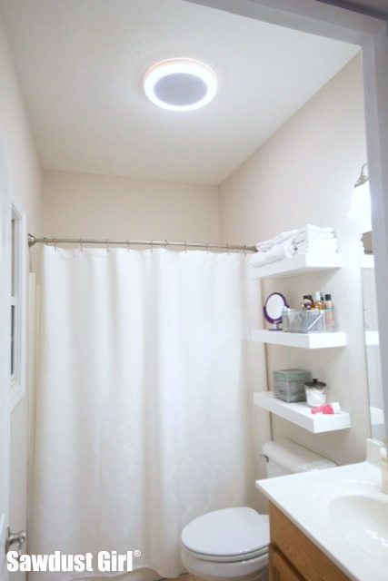 Shower light with store speaker