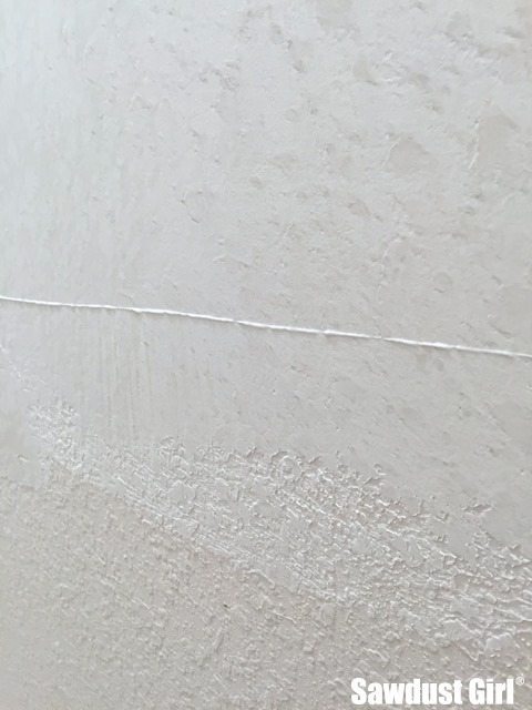 Skim Coating to get rid of ugly wall texture.