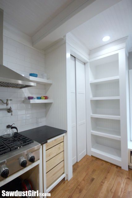 DIY sliding pocket doors for hidden pantry.