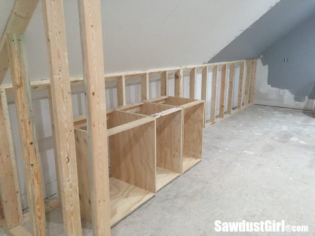 Building a wall behind cabinets to position them correctly in the room.