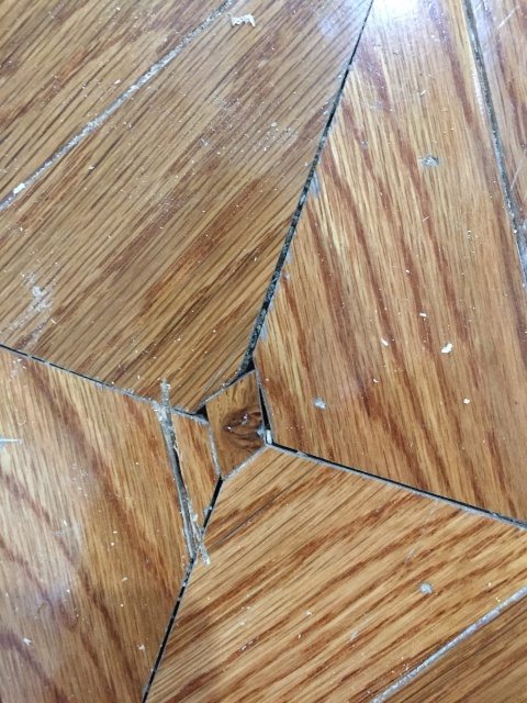 Replacing decorative flooring insert