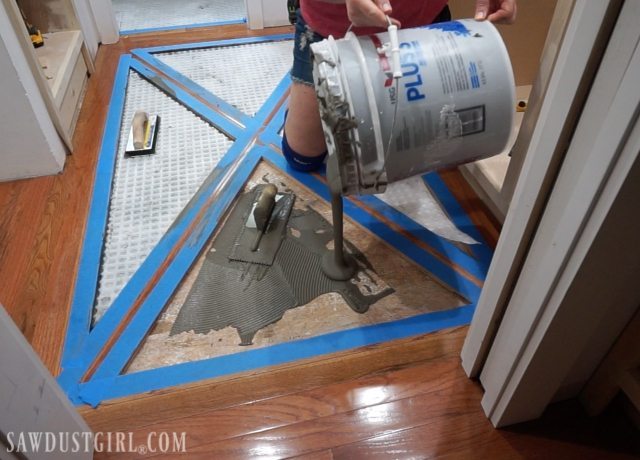 Wood floor with brick tile inlay