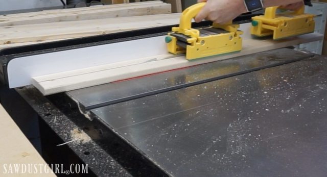 cutting a board on a table saw