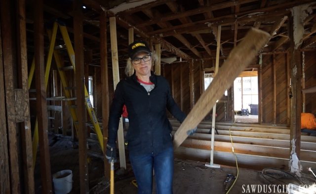 Tearing out termite ridden studs in Calderwood Cottage