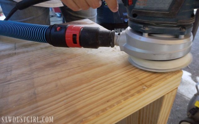 Sanding wood before staining with Briwax.