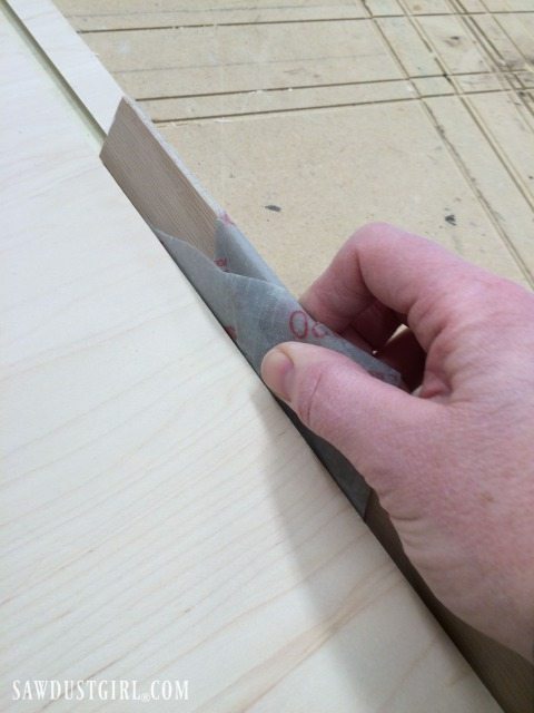 Groove cut in cabinet bottom to hold a steel bar track for sliding door