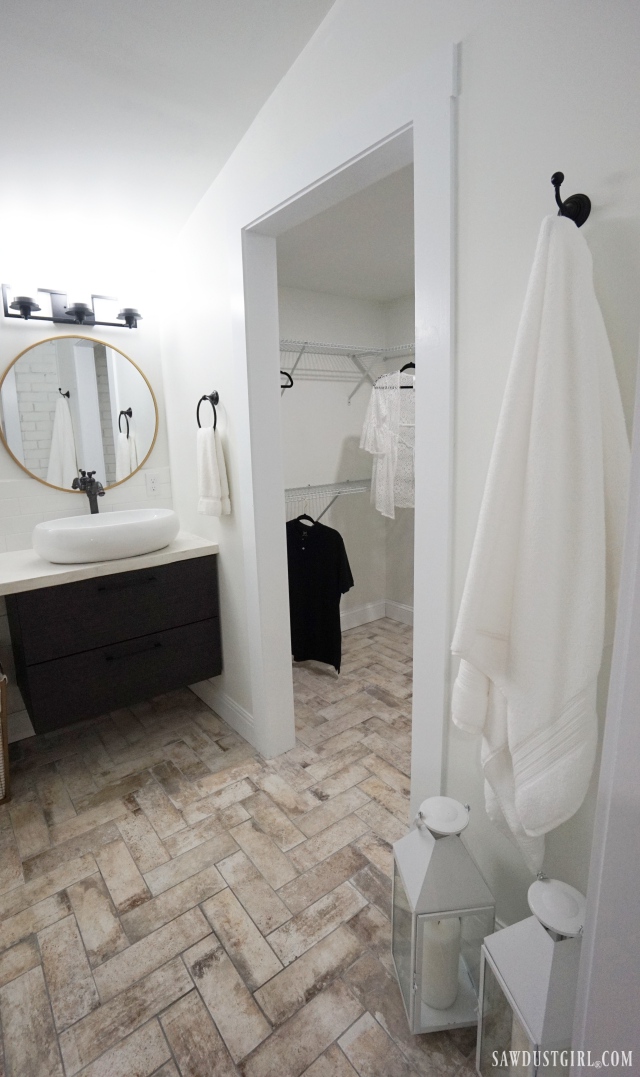 herringbone tile bathroom floor