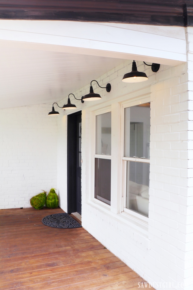 front porch, white brick, black accents, barn lights