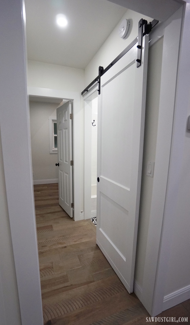 white barn door with black hardware