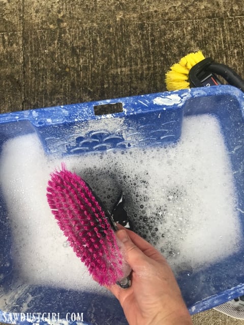 Clean garage door using mild dish detergent