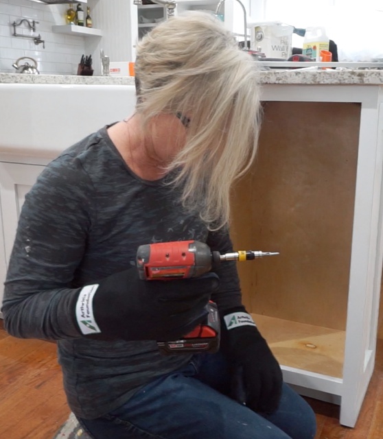 Building cabinet with arthritis simulation gloves