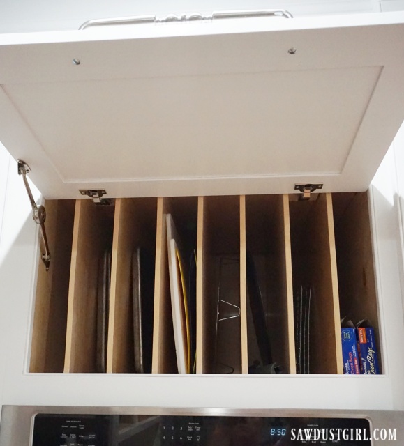 How to install hardware that lifts the cabinet door up and keeps it open.