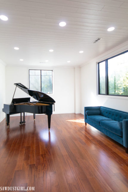 Beautiful plank ceilings hide suspended ceiling grid!