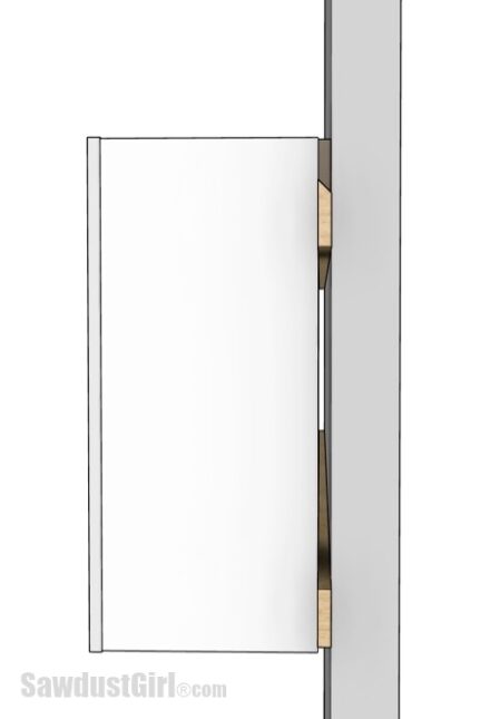 space behind cabinet created by french cleat attached to back of cabinet